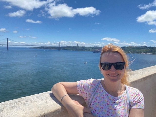 Brain injury survivor Merketa pictured by the coastline smiling