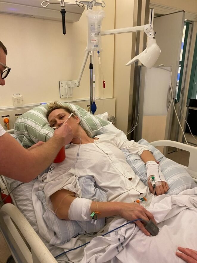 Brain injury survivor Elin pictured in a hospital bed after suffering from a brain haemorrhage