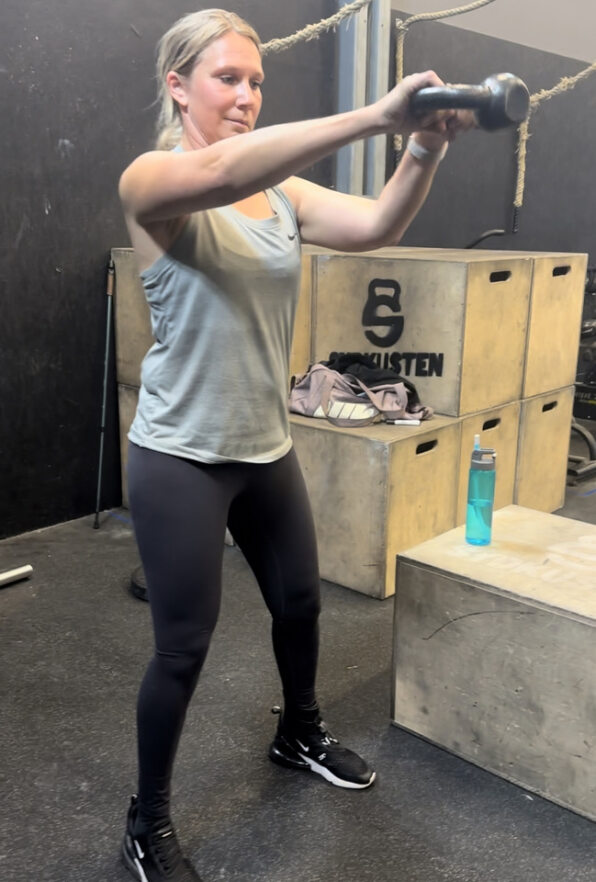 Brain injury Survivor Elin at the gym lifting weights after recovering from a brain haemorrhage